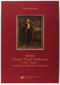 Okładka książki w kolorze bordowym, w środku portret księcia